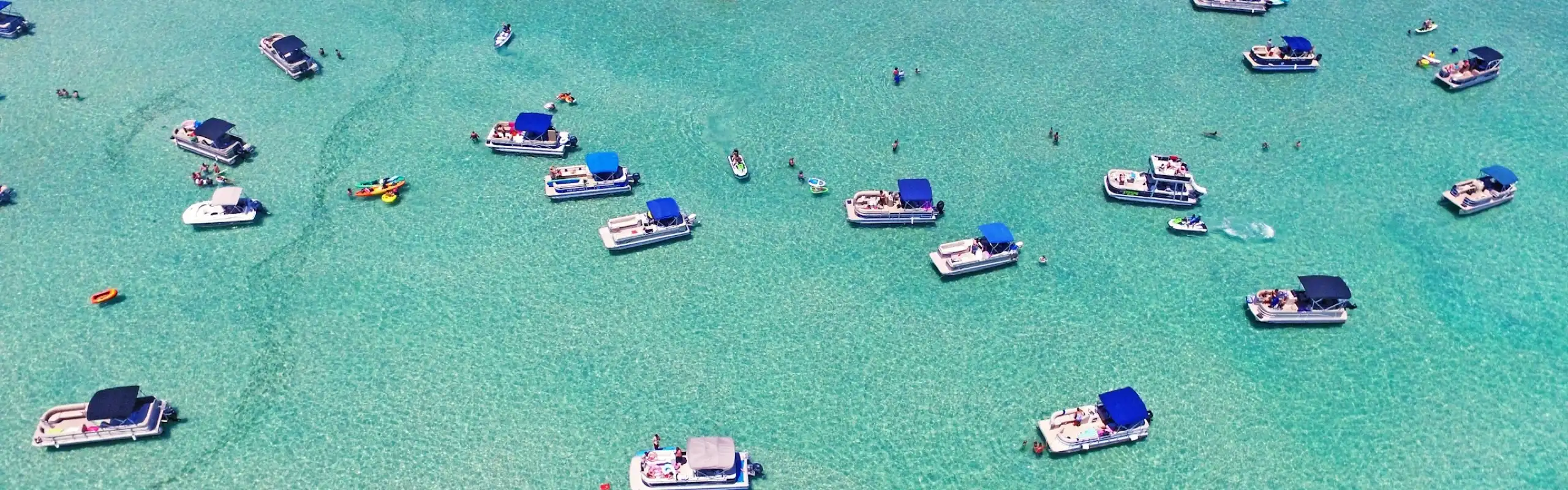 Boats gathered at Crab Island sandbar in Destin